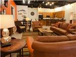Brown leather couches in the rec room at SANDPIPER RV RESORT - thumbnail