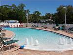 Swimming pool with outdoor seating at SEMINOLE CAMPGROUND - thumbnail