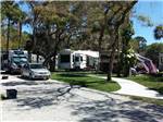 RV parked in tree shaded sites at SEMINOLE CAMPGROUND - thumbnail