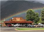 A rainbow behind the saloon at GREYS RIVER COVE RESORT - thumbnail