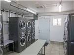 Laundry facilities with multiple washers and dryers at DESERT PUEBLO RV RESORT - thumbnail