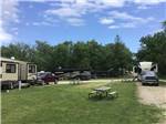 RVs parked in distance at R CAMPGROUND - thumbnail
