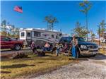 Friends hanging out near RV at NORTH LANDING BEACH RV RESORT & COTTAGES - thumbnail