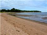 The sandy beach nearby at HARBOUR LIGHT TRAILER COURT & CAMPGROUND - thumbnail