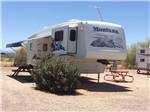Trailer and picnic table at CRAZY HORSE RV CAMPGROUNDS - thumbnail