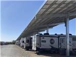 RVs parked under the covered sites at CRAZY HORSE RV CAMPGROUNDS - thumbnail