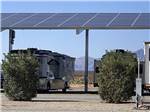 Motorhomes parked under the solar panels at CRAZY HORSE RV CAMPGROUNDS - thumbnail