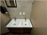 The clean bathroom sinks at WAGONS WEST RV PARK AND CAMPGROUND - thumbnail