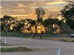 A row of empty RV sites at WAGONS WEST RV PARK AND CAMPGROUND - thumbnail