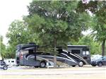 Motorhome parked at campground at BLUE SKY I-35 RV PARK - thumbnail