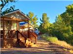 A row of rental cabins at VERDE RIVER RV RESORT & COTTAGES - thumbnail