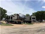 Trailers in gravel RV sites at PEACH COUNTRY RV PARK - thumbnail