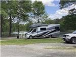 A row of RV sites by the water at WENDY OAKS RV RESORT - thumbnail