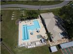 An aerial view of the pool and clubhouse at FOREST LAKE VILLAGE RV RESORT - thumbnail