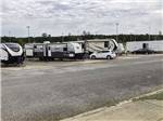 A row of gravel RV sites at LINCOLN CIVIC CENTER RV PARK - thumbnail