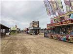 A carnival midway with food vendors at LINCOLN CIVIC CENTER RV PARK - thumbnail