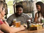 Two couples enjoying beer at a brewery at DESTINATION GETTYSBURG - thumbnail
