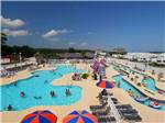 Swimming pool with umbrellas at MYRTLE BEACH CAMPGROUNDS - thumbnail