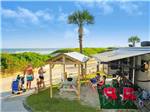 An RV campsite overlooking the ocean at MYRTLE BEACH CAMPGROUNDS - thumbnail