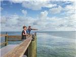 A dad teaching his sons how to fish nearby at BIG PINE KEY & FLORIDA LOWER KEYS - thumbnail