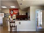 A front desk with chair and Good Sam banner at CLOVIS RV PARK - thumbnail
