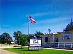 Campground office under American flag at CLOVIS RV PARK - thumbnail