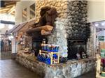 Stone fireplace near campground store at BUFFALO CROSSING RV PARK - thumbnail