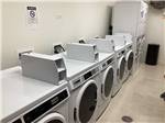 Row of dryers in campground laundry facility at BUFFALO CROSSING RV PARK - thumbnail