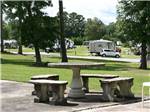 A table and seats next to the grass at VALDOSTA OAKS RV PARK - thumbnail