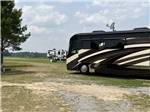 A motorhome parked in a grassy site at FARM COUNTRY CAMPGROUND - thumbnail