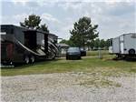 A motorhome and trailer parked at FARM COUNTRY CAMPGROUND - thumbnail
