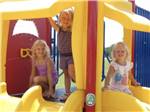 Three kids getting ready to go down the slides at VICTORIA COLETO LAKE RV RESORT - thumbnail