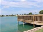 A wooden bridge in the lake at TEXAS LAKESIDE RV RESORT - thumbnail