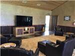 Chairs and TV in the social area at TEXAS LAKESIDE RV RESORT - thumbnail