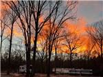 The orange, yellow clouds over the sites at KOUNTRY AIR RV PARK - thumbnail