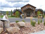 The recreation hall with golf carts in front at MOUNTAIN VALLEY RV RESORT - thumbnail