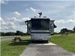 Front view of Class A motorhome at campsite at GRAND OAKS RESORT - thumbnail