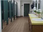 The clean bathrooms with flowers at SHREVEPORT/BOSSIER KOA JOURNEY - thumbnail