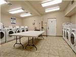 Laundry room with washer and dryers at SHADY CREEK RV PARK AND STORAGE - thumbnail