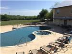 Swimming pool and spa with lounges at ALSATIAN RV RESORT & GOLF CLUB - thumbnail