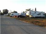 A row of filled RV sites at LAZY J RV & MOBILE HOME PARK - thumbnail
