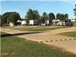 A gravel road leading to the RV sites at GREEN ACRES RV PARK - thumbnail