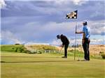 A couple of people playing golf at THE RV PARK AT ROLLING HILLS CASINO AND RESORT - thumbnail