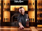 A man offering you a shot of rum in the Tasting Room at THE RV PARK AT ROLLING HILLS CASINO AND RESORT - thumbnail