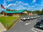 Aerial view of a lot of golf carts parked by the office at MOOSE HILLOCK CAMPING RESORT NY - thumbnail