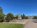 A row of paved RV sites at NEW FRONTIER RV PARK - thumbnail