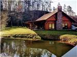 A rustic building by the water at VALLEY RIVER RV RESORT - thumbnail