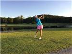 Girl golfing at QUAIL CREEK RV RESORT - thumbnail