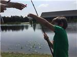Boy fishing at QUAIL CREEK RV RESORT - thumbnail