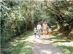 Family walking down trail at FRIENDS LANDING RV PARK - thumbnail